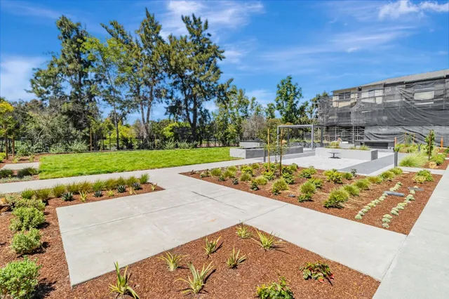 swimming pool view with a seating space