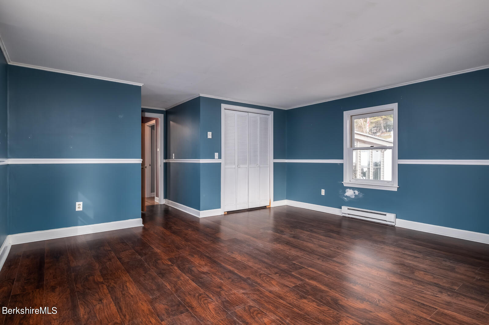 24 Henderson Road Williamstown, MA 01267 - Photo 12 of 17 a view of an empty room with window and wooden floor