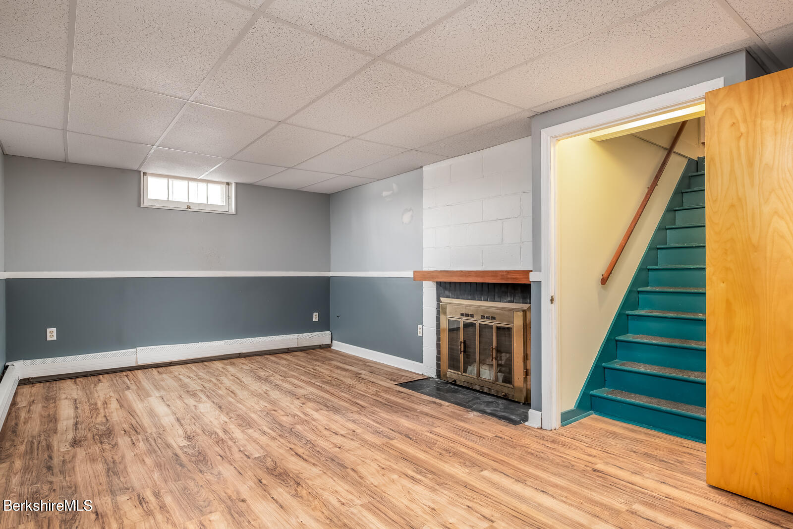 24 Henderson Road Williamstown, MA 01267 - Photo 14 of 17 a view of an empty room with wooden floor fireplace and a window