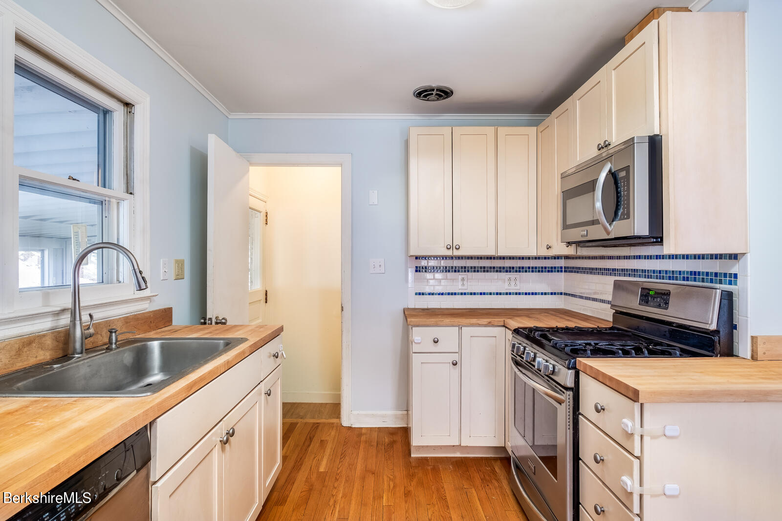 24 Henderson Road Williamstown, MA 01267 - Photo 2 of 17 a kitchen with granite countertop a sink cabinets and stainless steel appliances