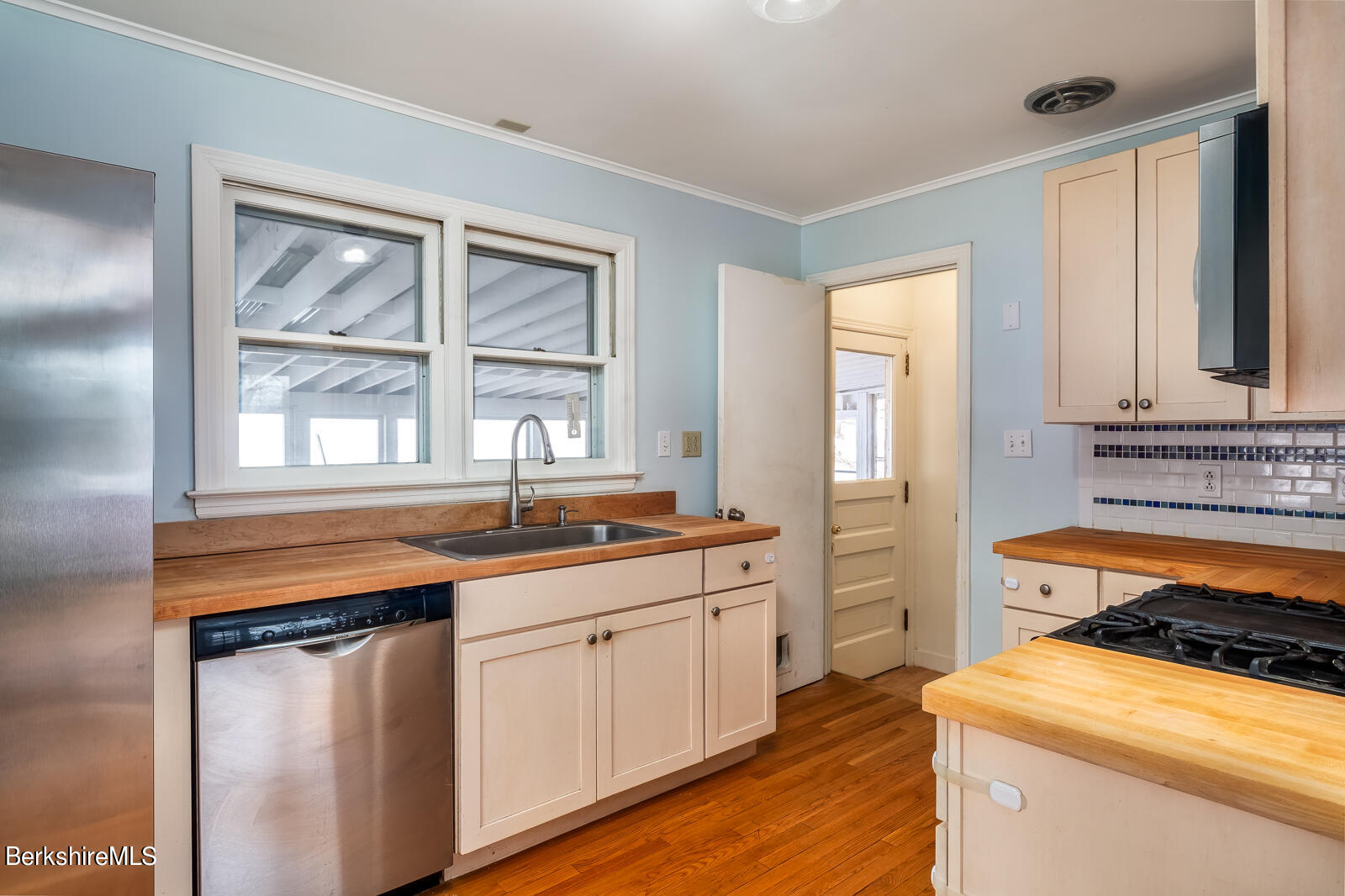 24 Henderson Road Williamstown, MA 01267 - Photo 4 of 17 a kitchen with stainless steel appliances granite countertop a sink and a stove next to a window