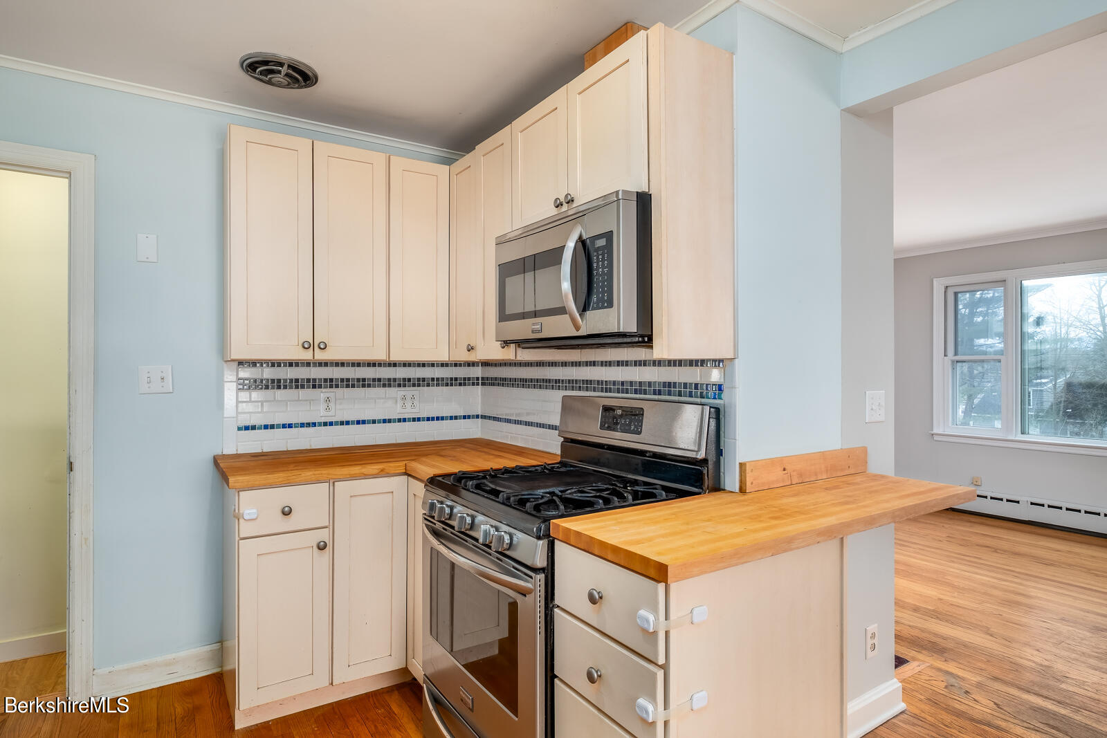 24 Henderson Road Williamstown, MA 01267 - Photo 5 of 17 a kitchen with stainless steel appliances granite countertop a stove a sink and a microwave