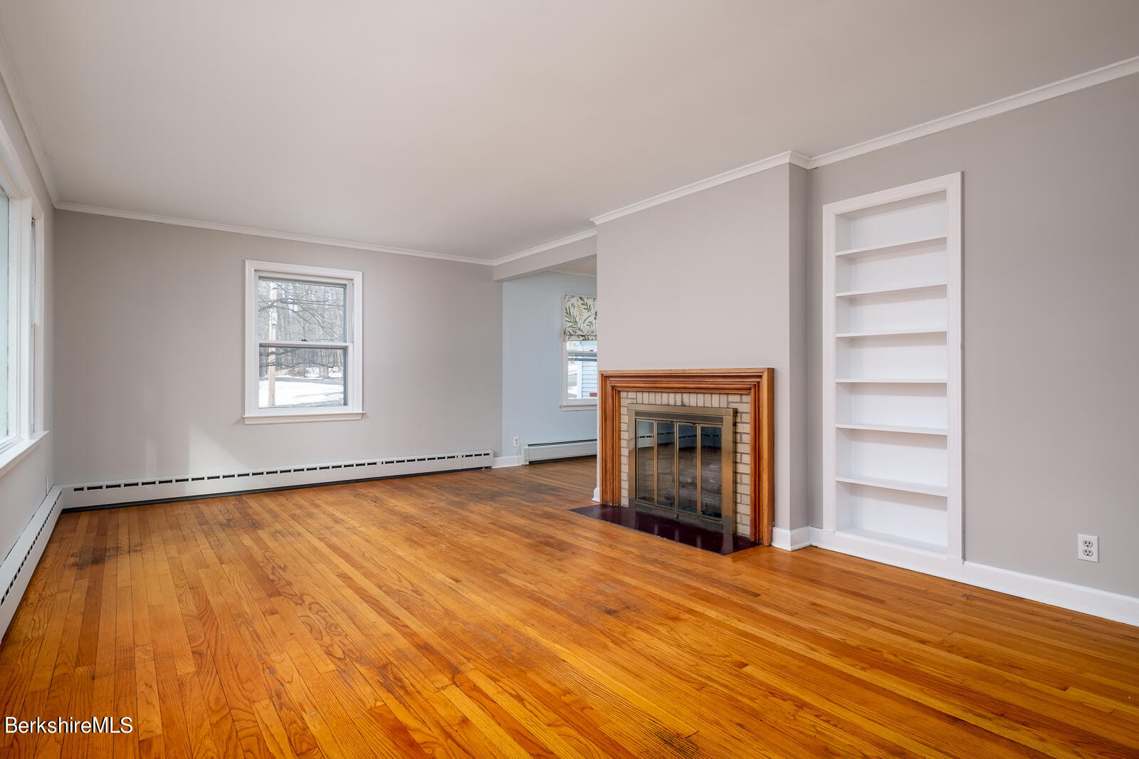 24 Henderson Road Williamstown, MA 01267 - Photo 7 of 17 a view of an empty room with a fireplace and a window