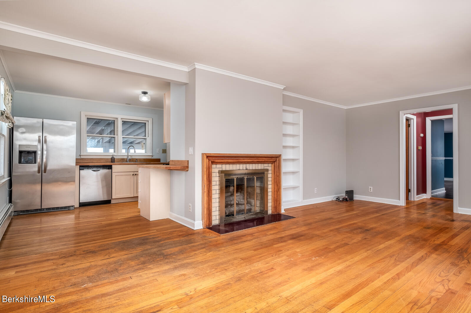 24 Henderson Road Williamstown, MA 01267 - Photo 8 of 17 a view of empty room with kitchen and fireplace