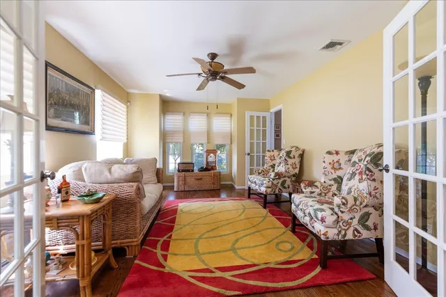 a living room with lots of furniture and a chandelier