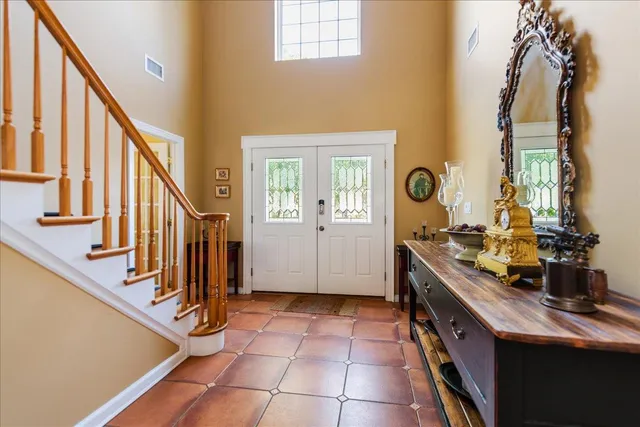 a view of a kitchen with furniture and staircase