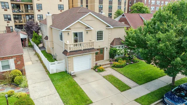 an aerial view of multiple houses with yard