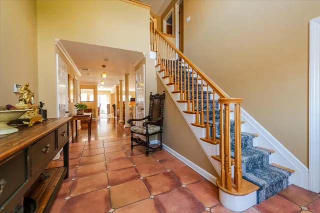 a view of entryway and hall with dining room