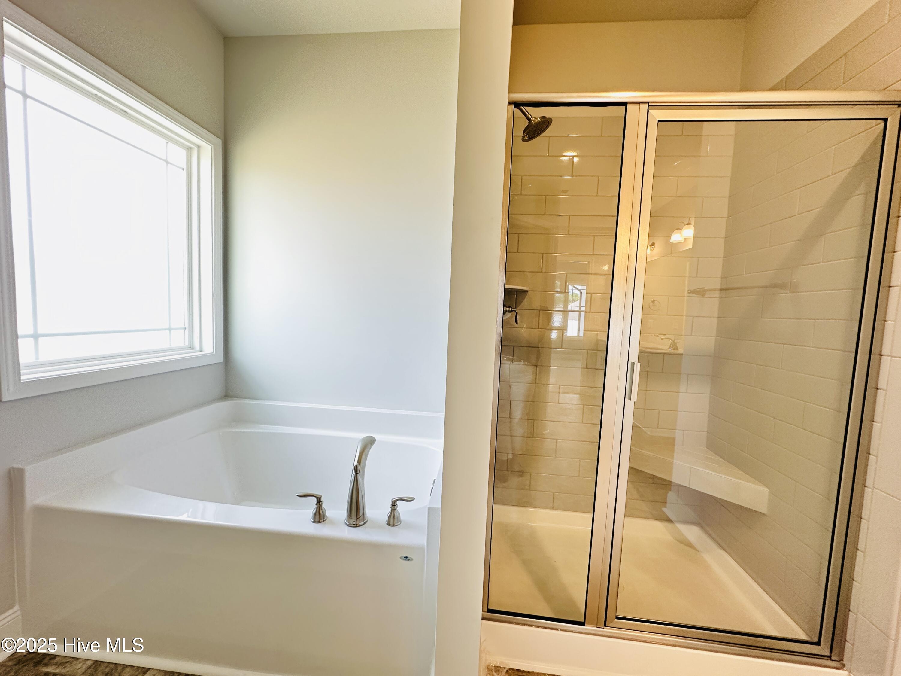 4020 Fletcher Road, Unit LOT 182 Bailey, NC 27807 - Photo 17 of 26 Separate Tub/Shower in Primary Bathroom