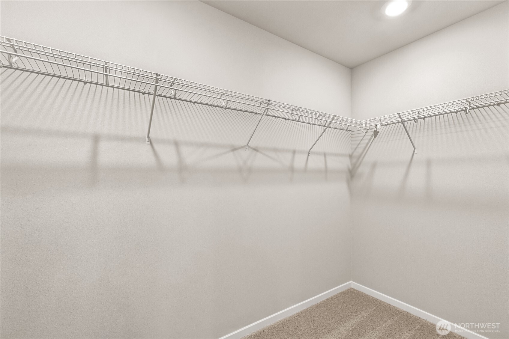 3916 98th Ave Court East, Unit 13 Edgewood, WA 98371 - Photo 13 of 32 a view of a room with racks on the wall