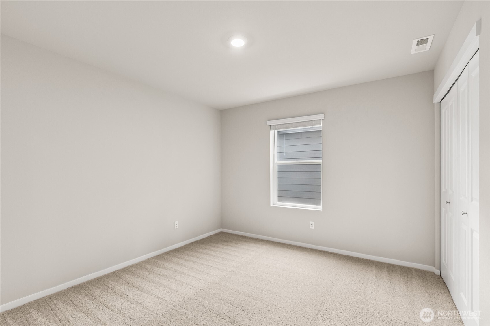 3916 98th Ave Court East, Unit 13 Edgewood, WA 98371 - Photo 25 of 32 an empty room with a window