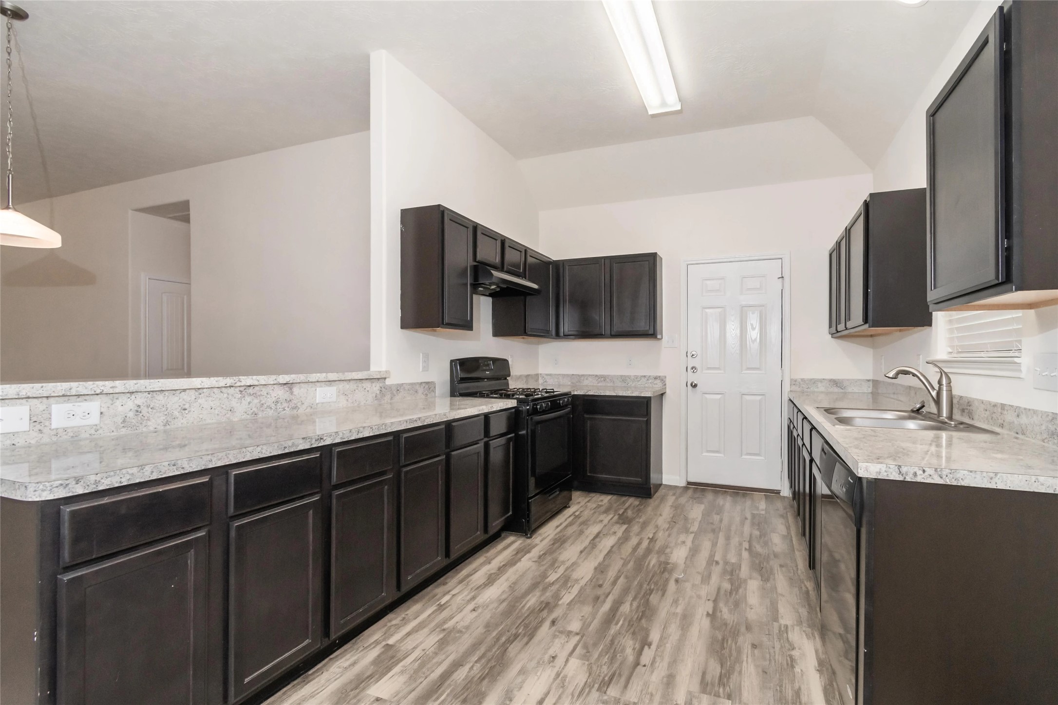 699 Fallow Lane Alvin, TX 77511 - Photo 1 of 7 a kitchen with stainless steel appliances granite countertop a sink stove and refrigerator
