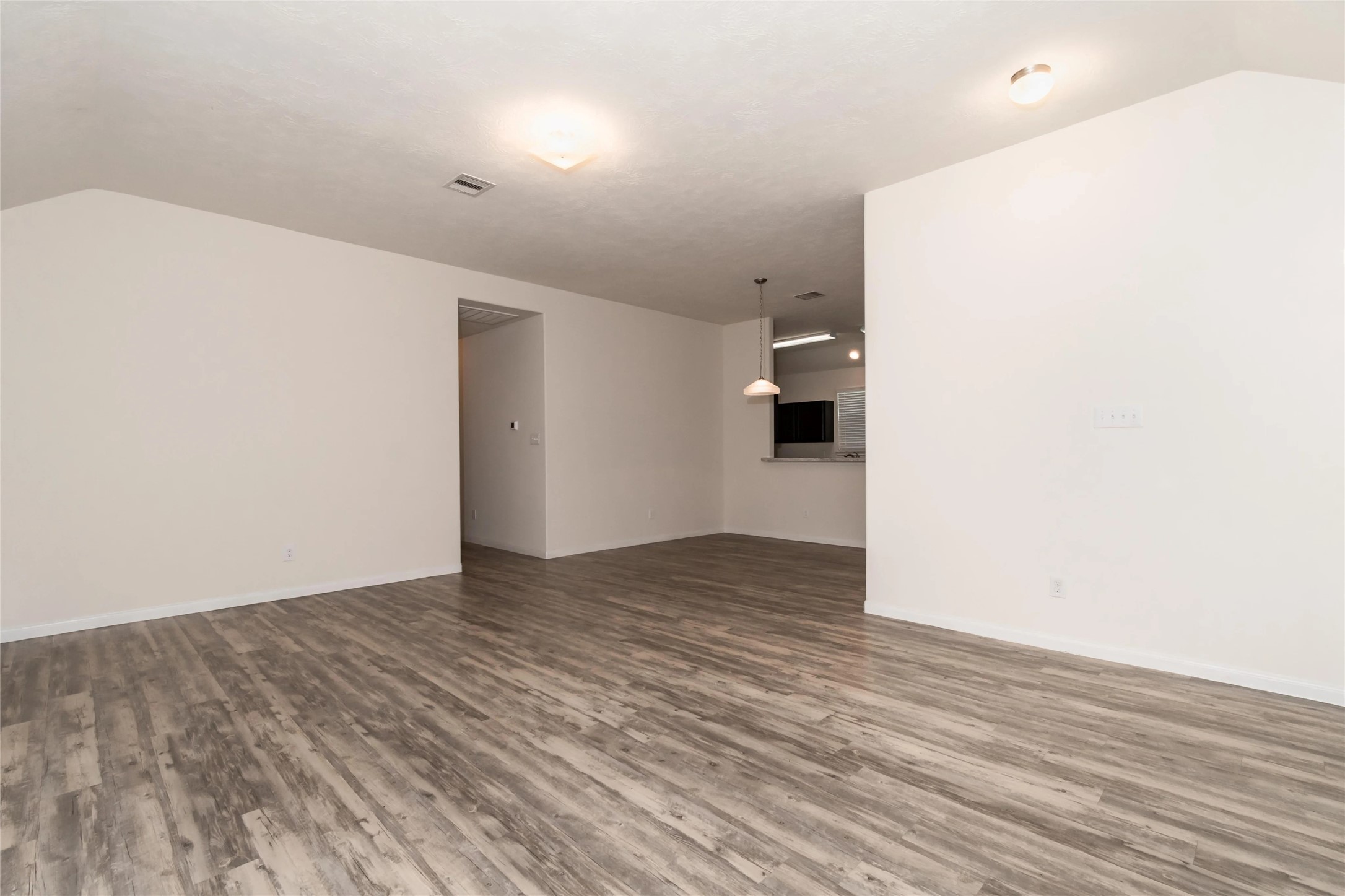 699 Fallow Lane Alvin, TX 77511 - Photo 4 of 7 a view of empty room with wooden floor