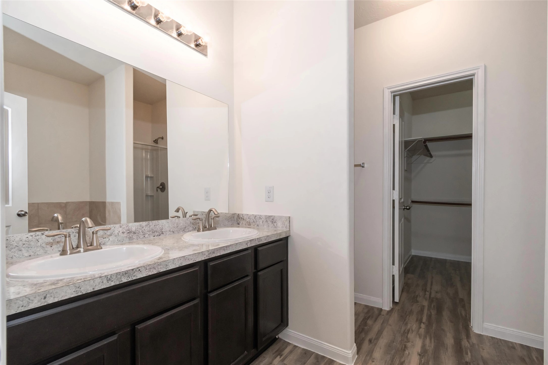 699 Fallow Lane Alvin, TX 77511 - Photo 6 of 7 a bathroom with a granite countertop sink and a mirror