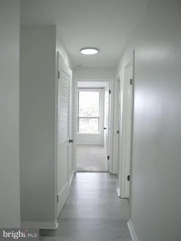 a bathroom with a shower a toilet and a sink