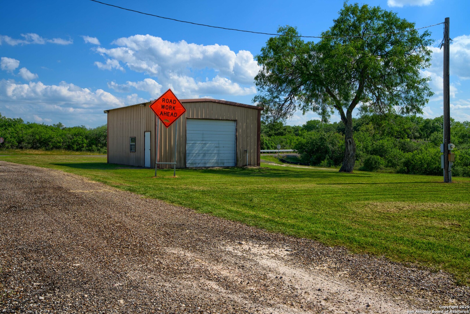 101 Campbell Road 3 Road Sandia, TX 78383 - Photo 104 of 105 a front view of a house with a yard and garage