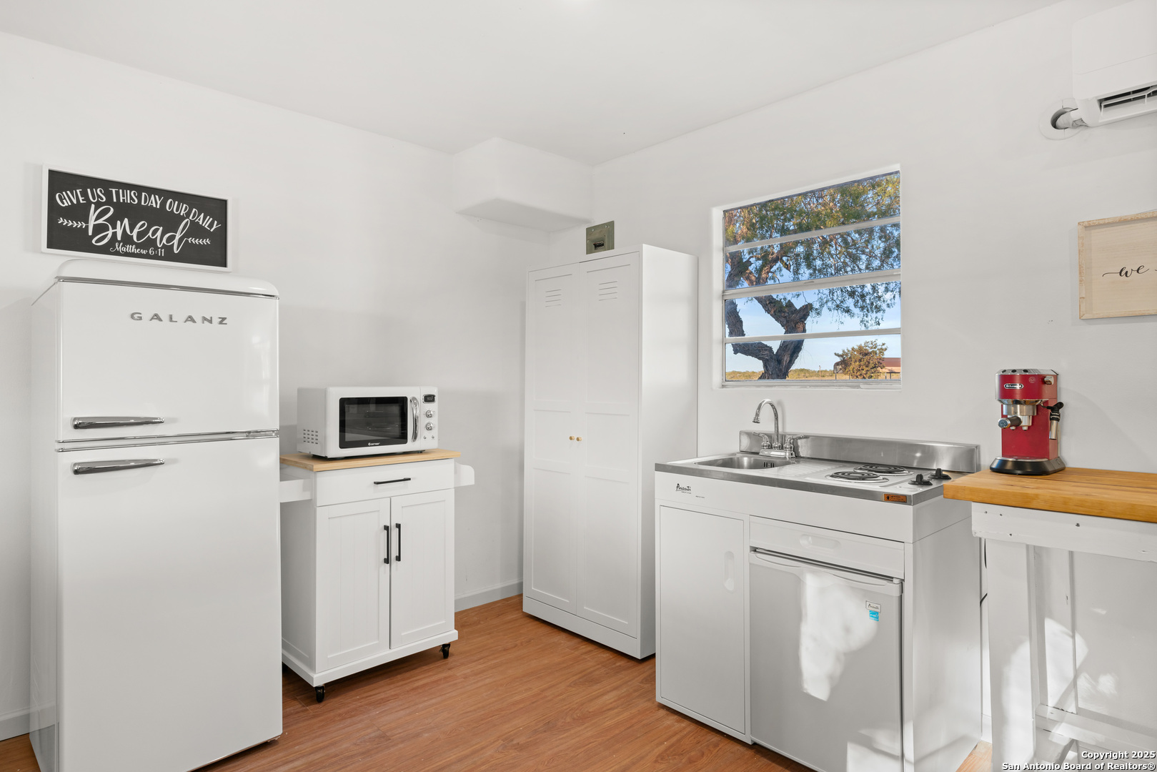 101 Campbell Road 3 Road Sandia, TX 78383 - Photo 11 of 105 a kitchen with stainless steel appliances a stove refrigerator sink and wooden floor