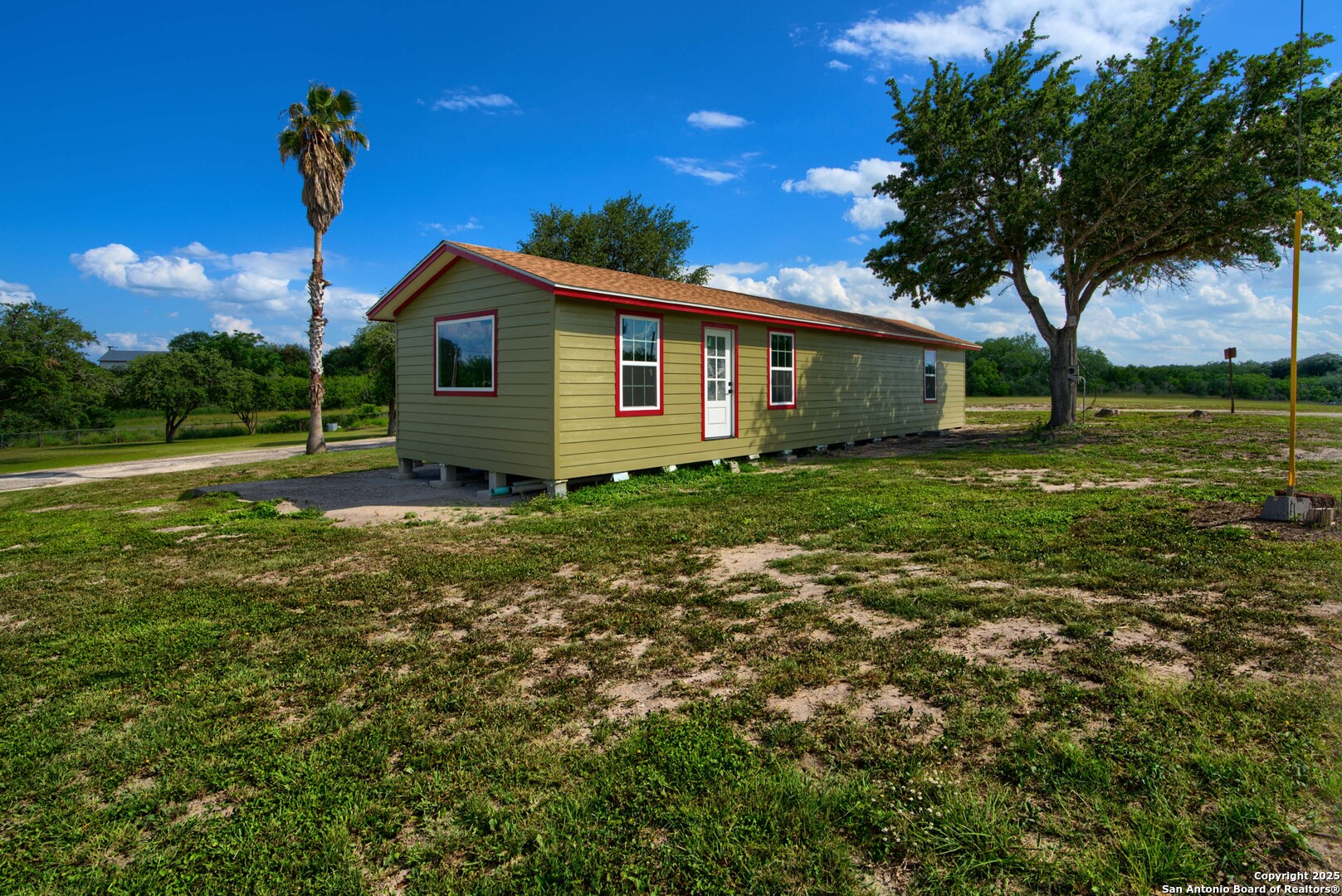 101 Campbell Road 3 Road Sandia, TX 78383 - Photo 33 of 105 a backyard of a house with lots of green space