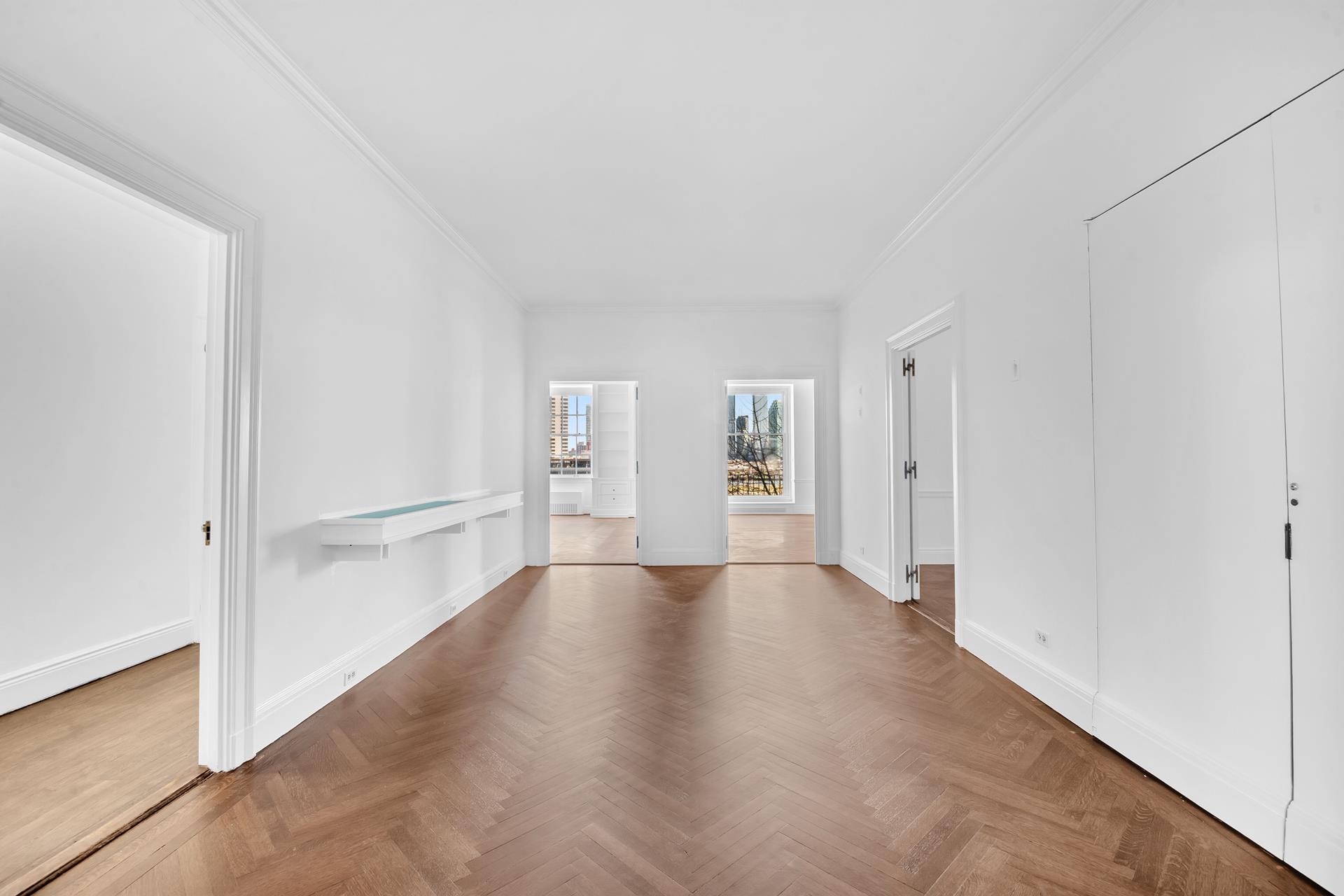 1 Sutton Place South, Unit 4C Manhattan, NY 10022 - Photo 9 of 35 a view of a livingroom with wooden floor and front door