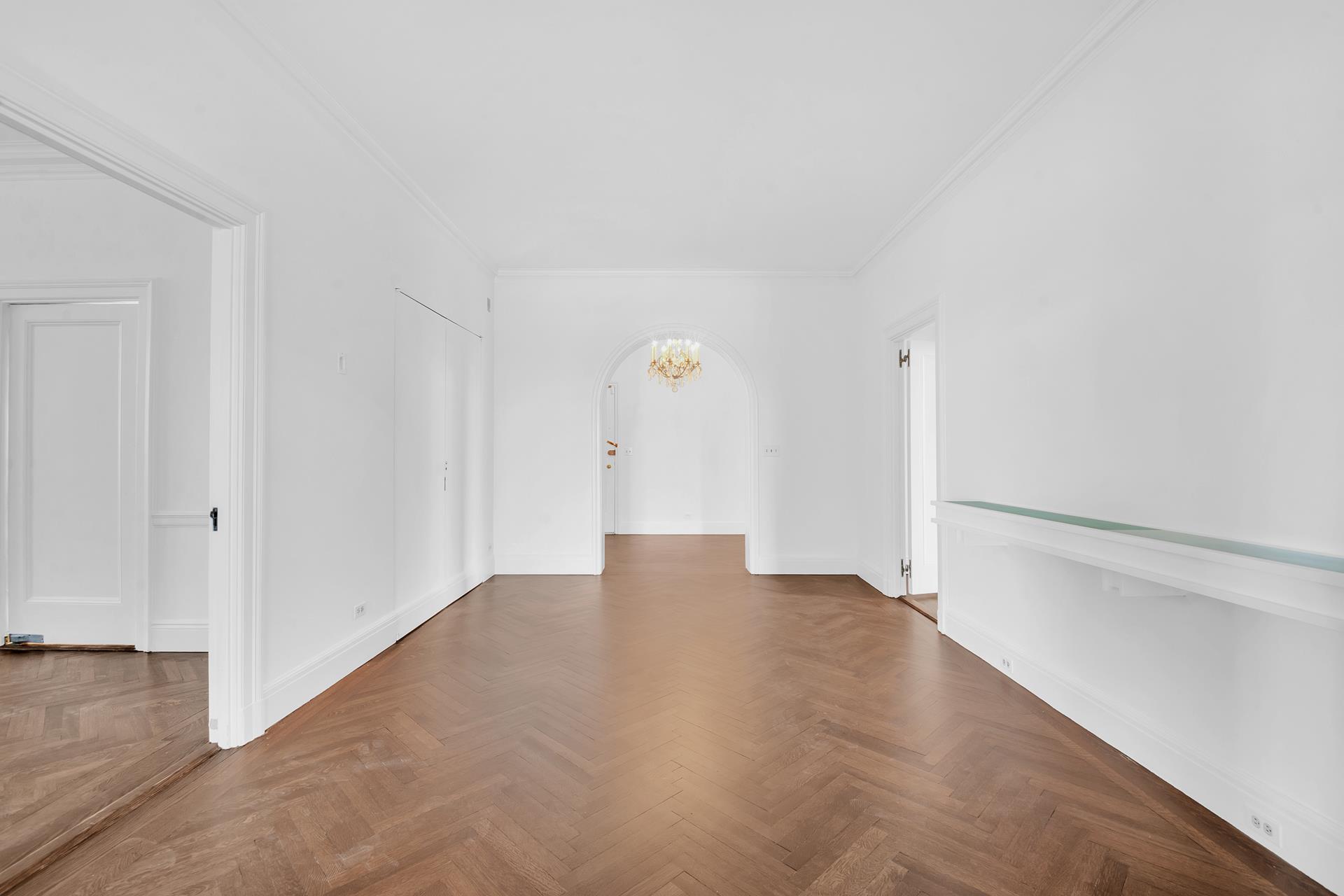 1 Sutton Place South, Unit 4C Manhattan, NY 10022 - Photo 10 of 35 a view of an empty room with wooden floor