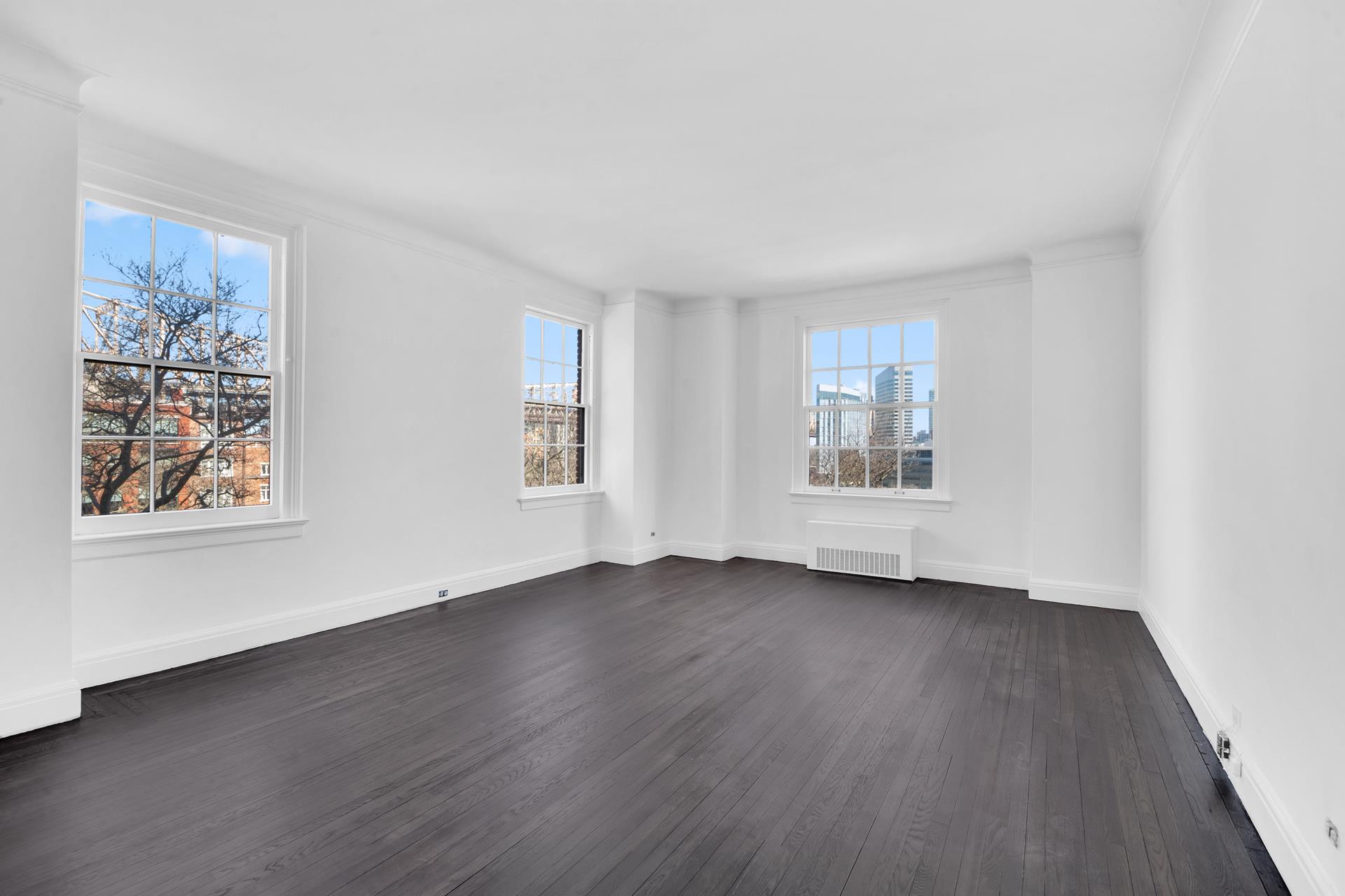 1 Sutton Place South, Unit 4C Manhattan, NY 10022 - Photo 15 of 35 a view of an empty room with wooden floor and window