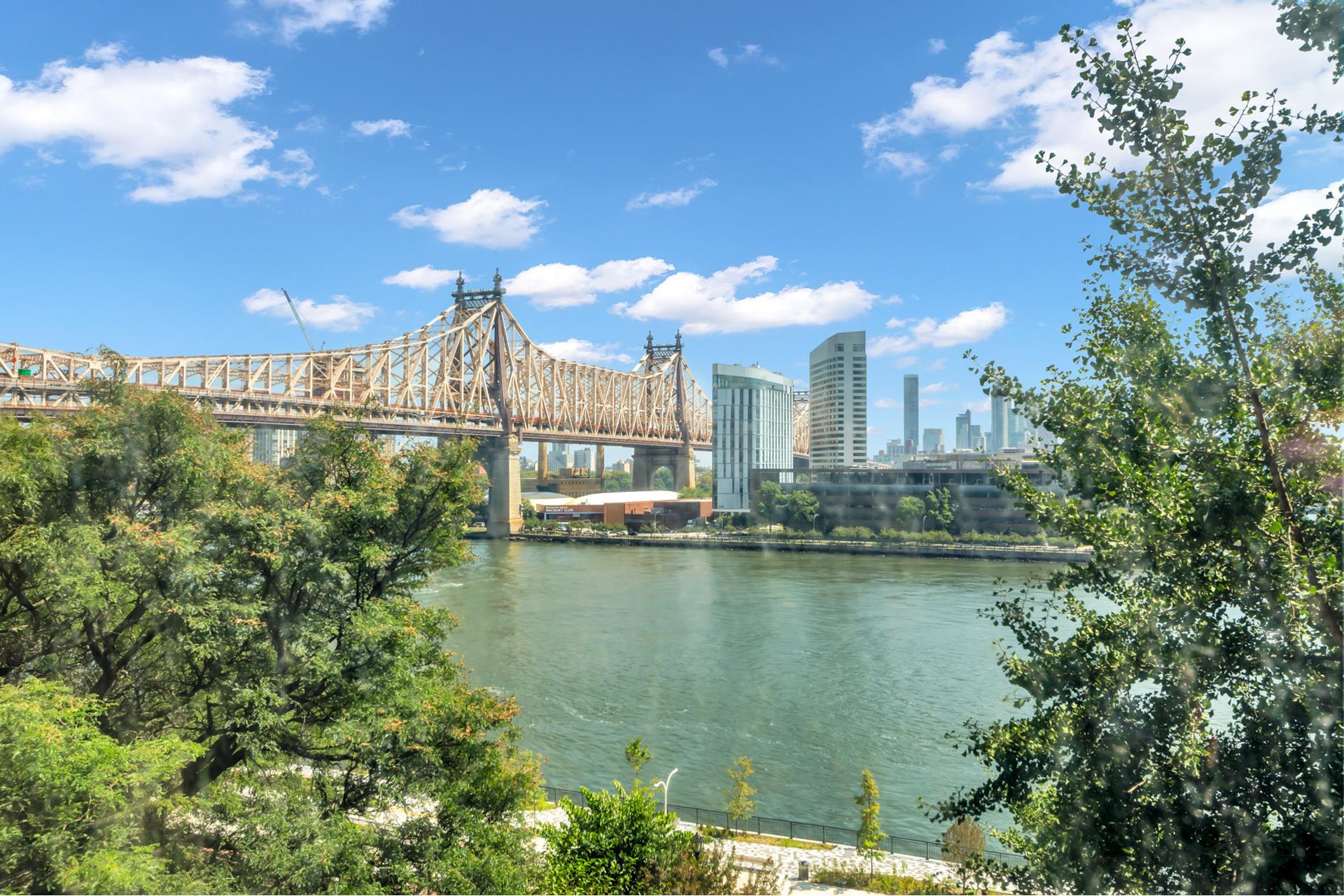 1 Sutton Place South, Unit 4C Manhattan, NY 10022 - Photo 16 of 35 a view of a lake with a city