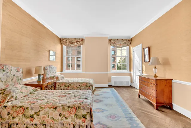 a spacious bedroom with a large bed and a couch