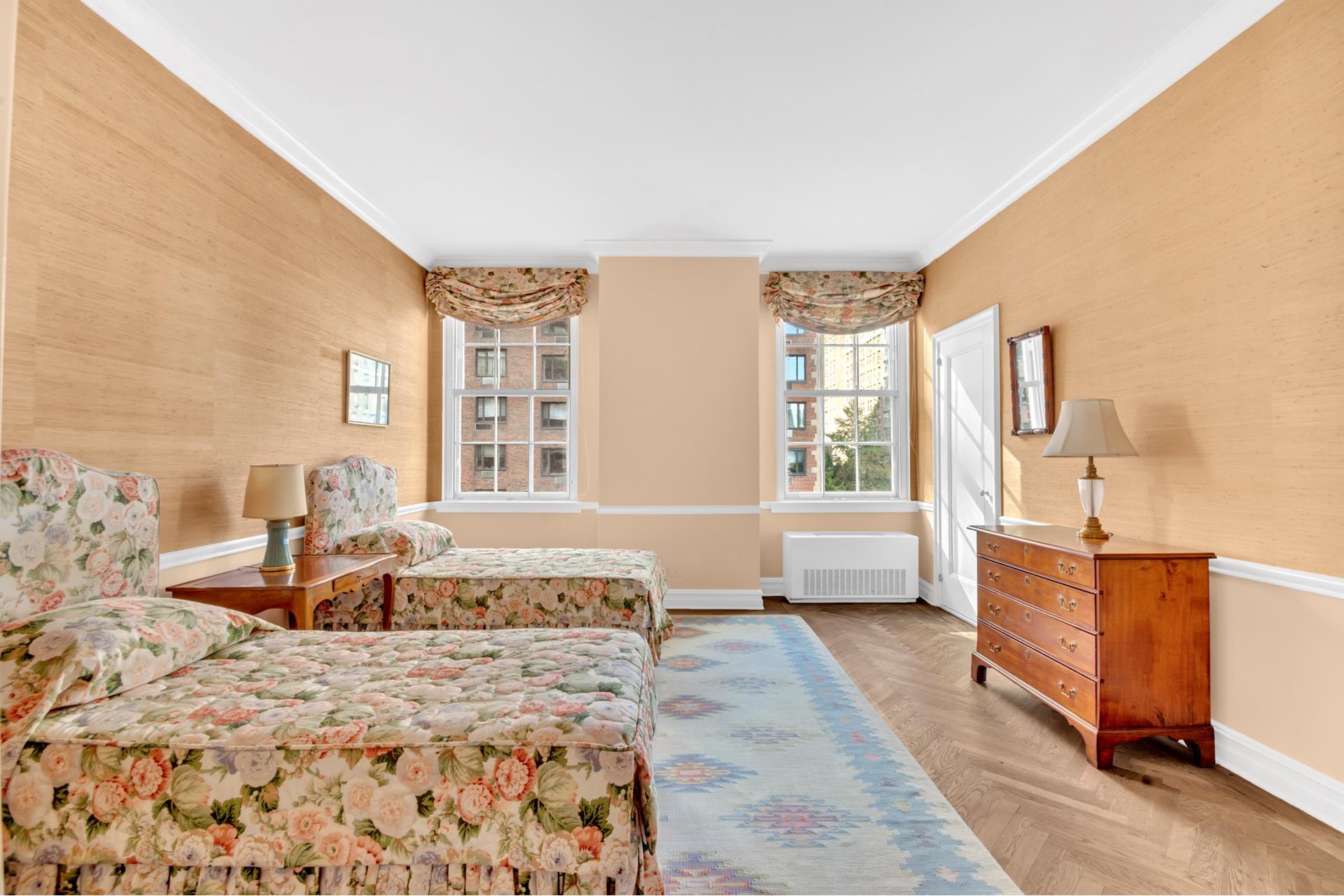 1 Sutton Place South, Unit 4C Manhattan, NY 10022 - Photo 20 of 35 a spacious bedroom with a large bed and a couch