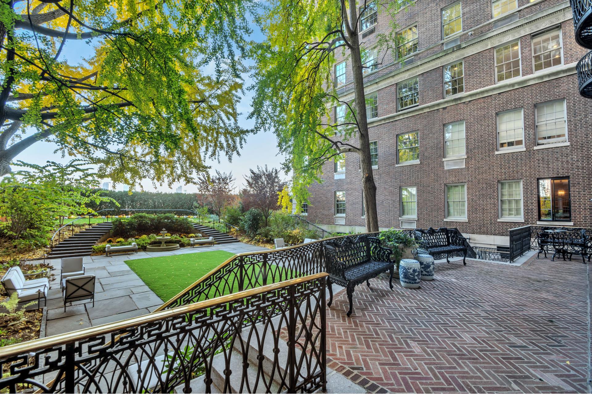 1 Sutton Place South, Unit 4C Manhattan, NY 10022 - Photo 23 of 35 a view of a patio with couches table and chairs and potted plants
