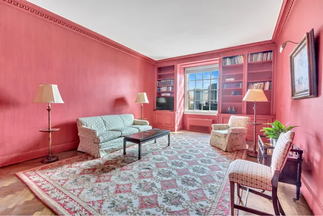 a dining room with furniture and a window