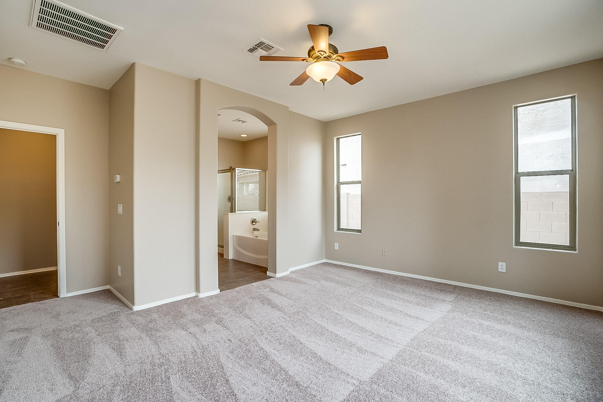 3282 East Blue Ridge Way Gilbert, AZ 85298 - Photo 9 of 20 a view of an empty room with a window