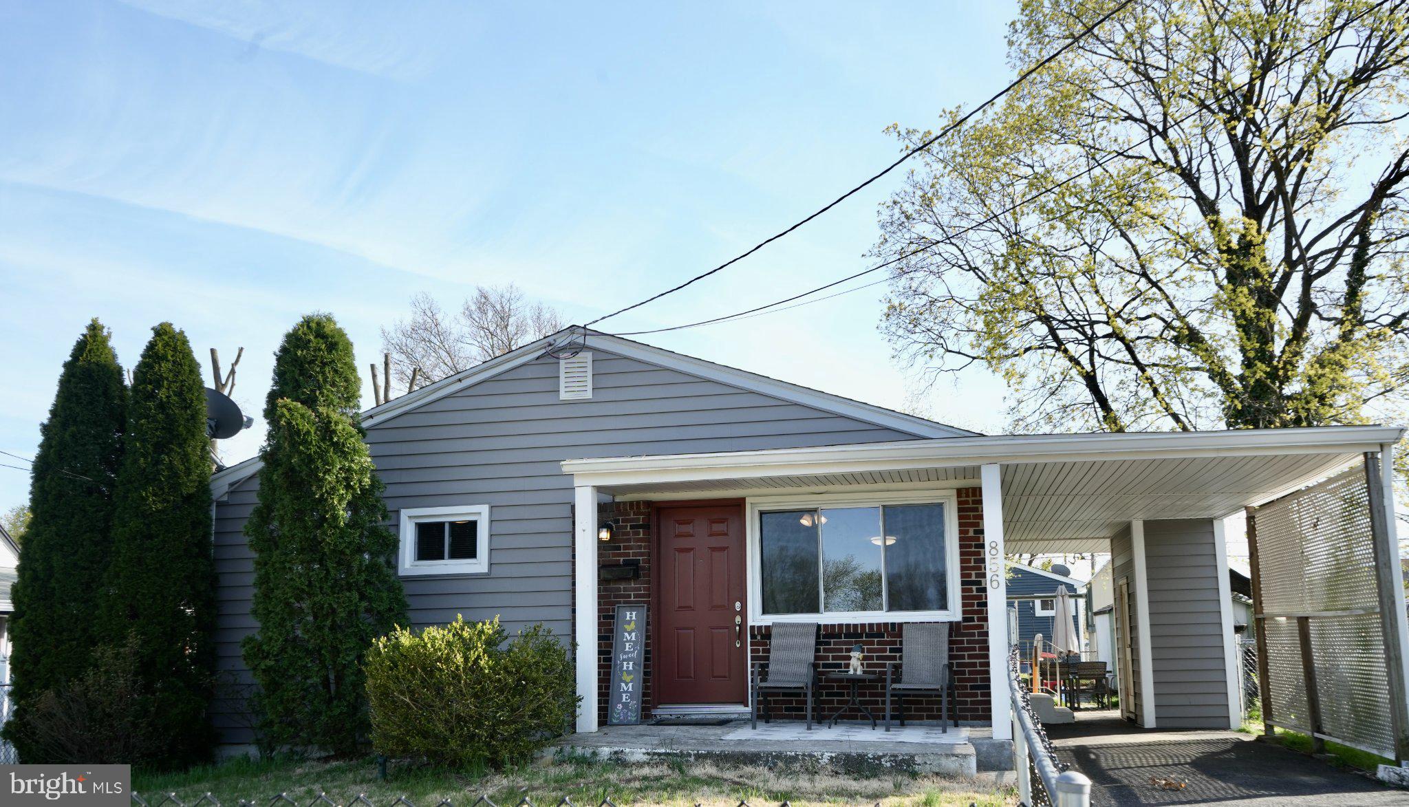 856 Woodlane Road Mount Holly, NJ 08060 - Photo 1 of 24 Charming gray home with lush greenery.