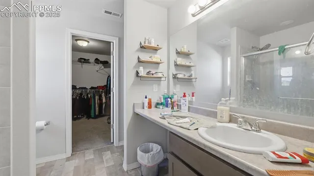 a bathroom with a sink double vanity and a mirror