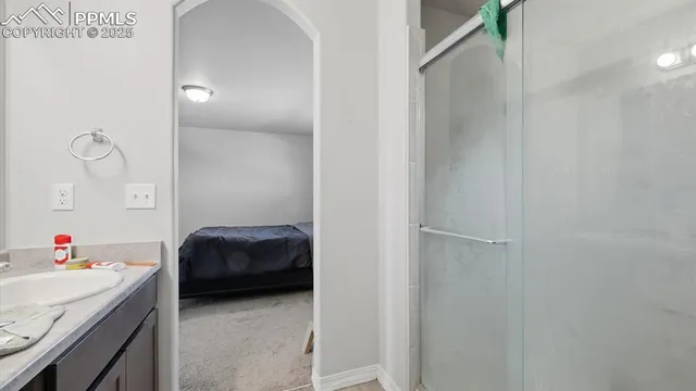 a en suite bathroom with a sink and a mirror