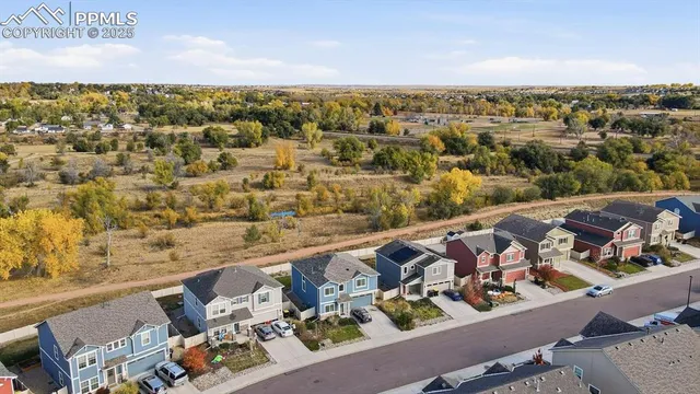 an aerial view of a house with a garden