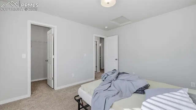 a room with a bed and a mirror