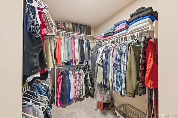 a bathroom with a sink toilet a mirror and shower curtain