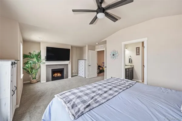 a bathroom with a granite countertop sink a large mirror and a shower