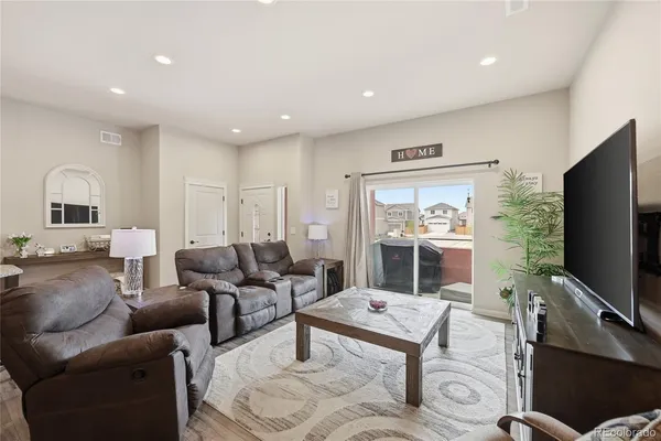 a kitchen with stainless steel appliances granite countertop a sink refrigerator and cabinets