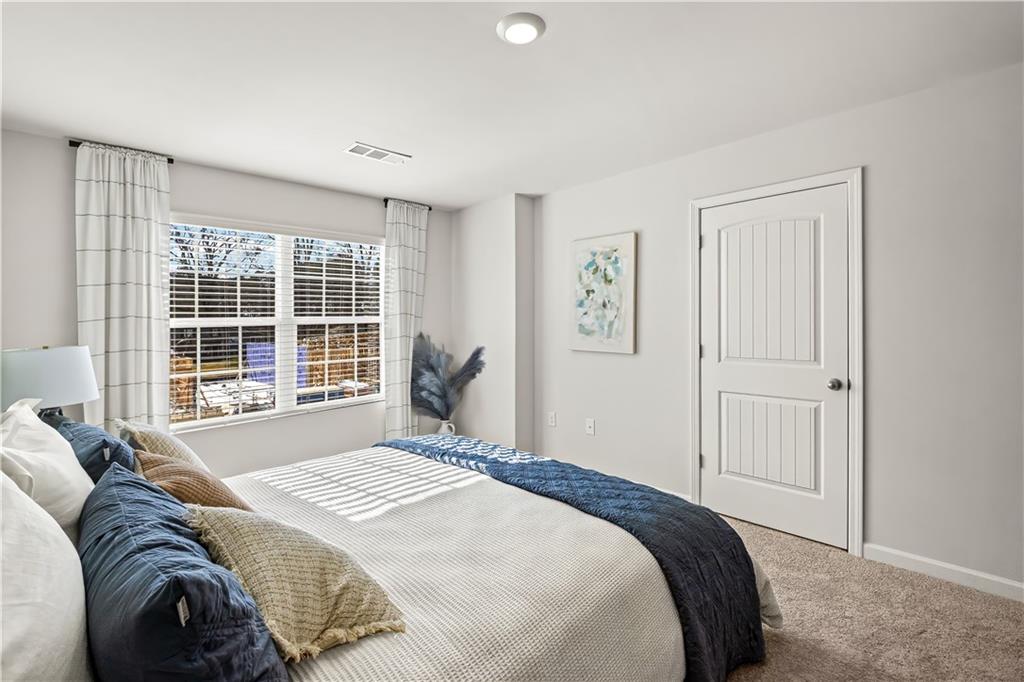 3 Silverbell Lane Northwest Rome, GA 30165 - Photo 15 of 19 a bedroom with a bed and a large window