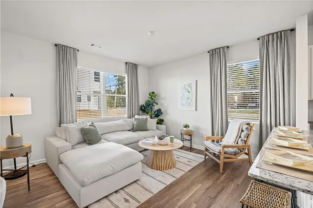a living room with furniture and a large window