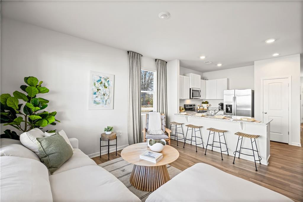 3 Silverbell Lane Northwest Rome, GA 30165 - Photo 8 of 19 a living room with stainless steel appliances furniture a dining table and chairs