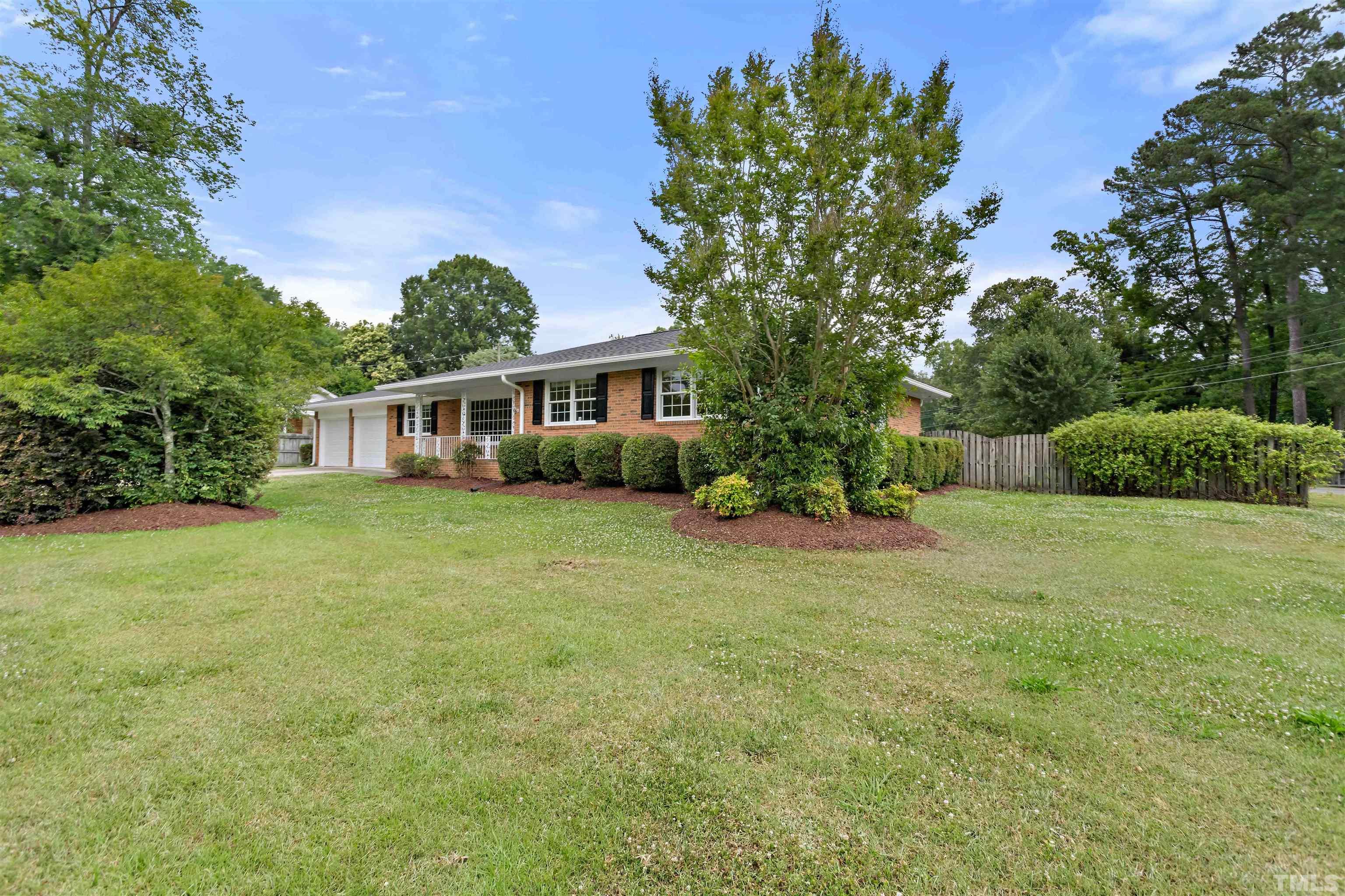 4811 Greenbrier Road Raleigh, NC 27603 - Photo 1 of 41 a house view with a garden space