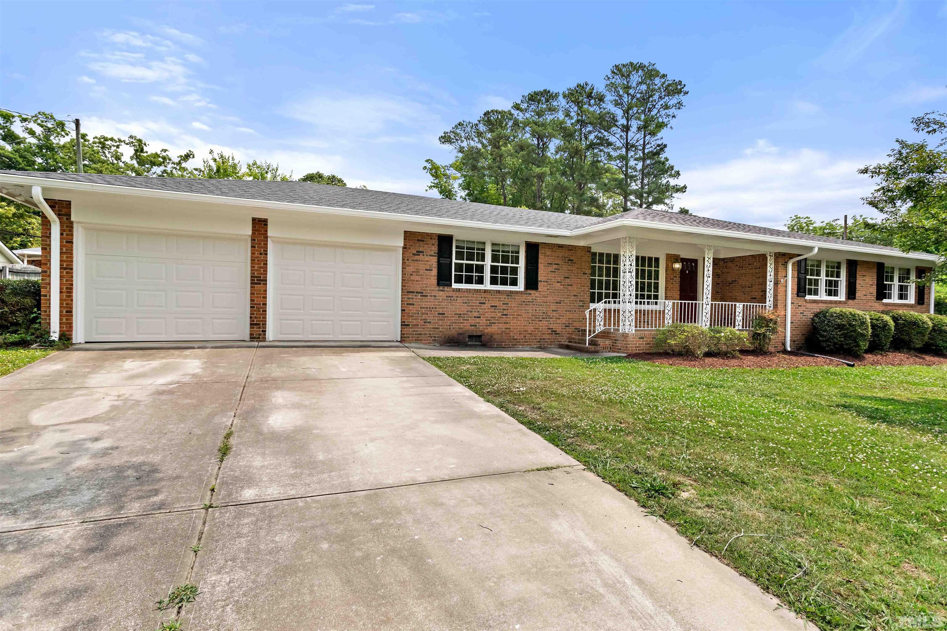 4811 Greenbrier Road Raleigh, NC 27603 - Photo 2 of 41 a front view of house with yard and green space
