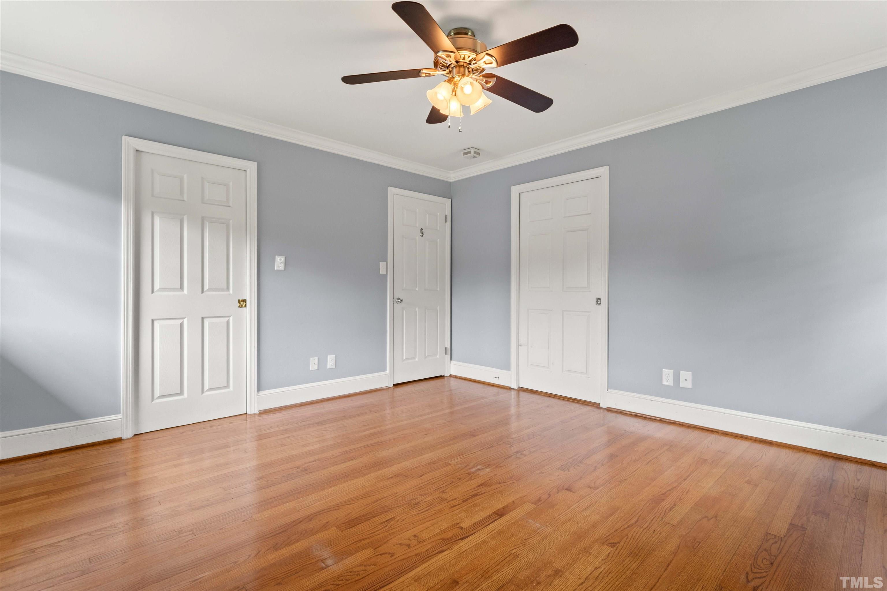 4811 Greenbrier Road Raleigh, NC 27603 - Photo 24 of 41 a view of an empty room with window and a ceiling fan