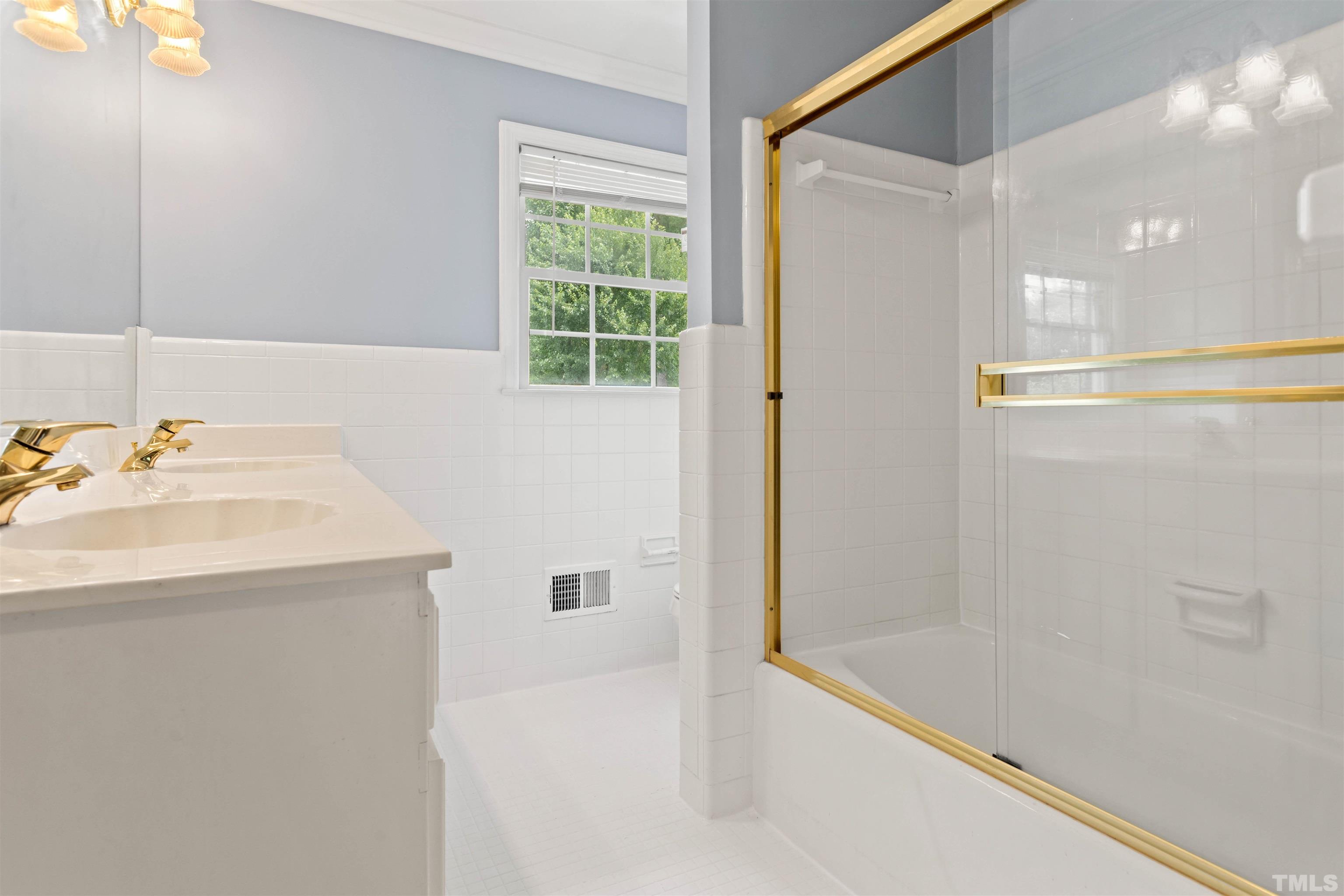 4811 Greenbrier Road Raleigh, NC 27603 - Photo 28 of 41 a bathroom with a bathtub and a sink