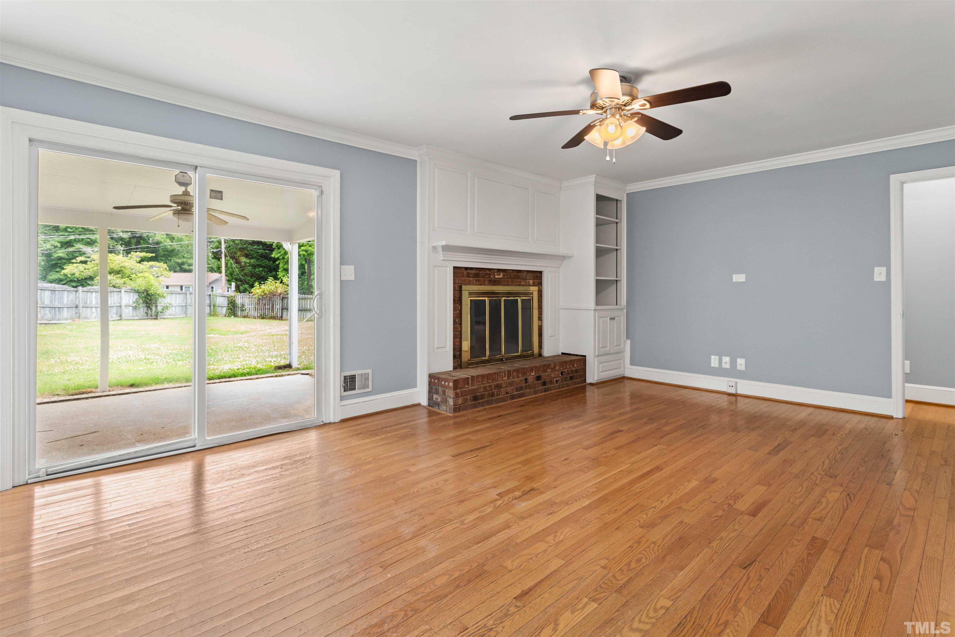 4811 Greenbrier Road Raleigh, NC 27603 - Photo 33 of 41 a view of an empty room with wooden floor and a window