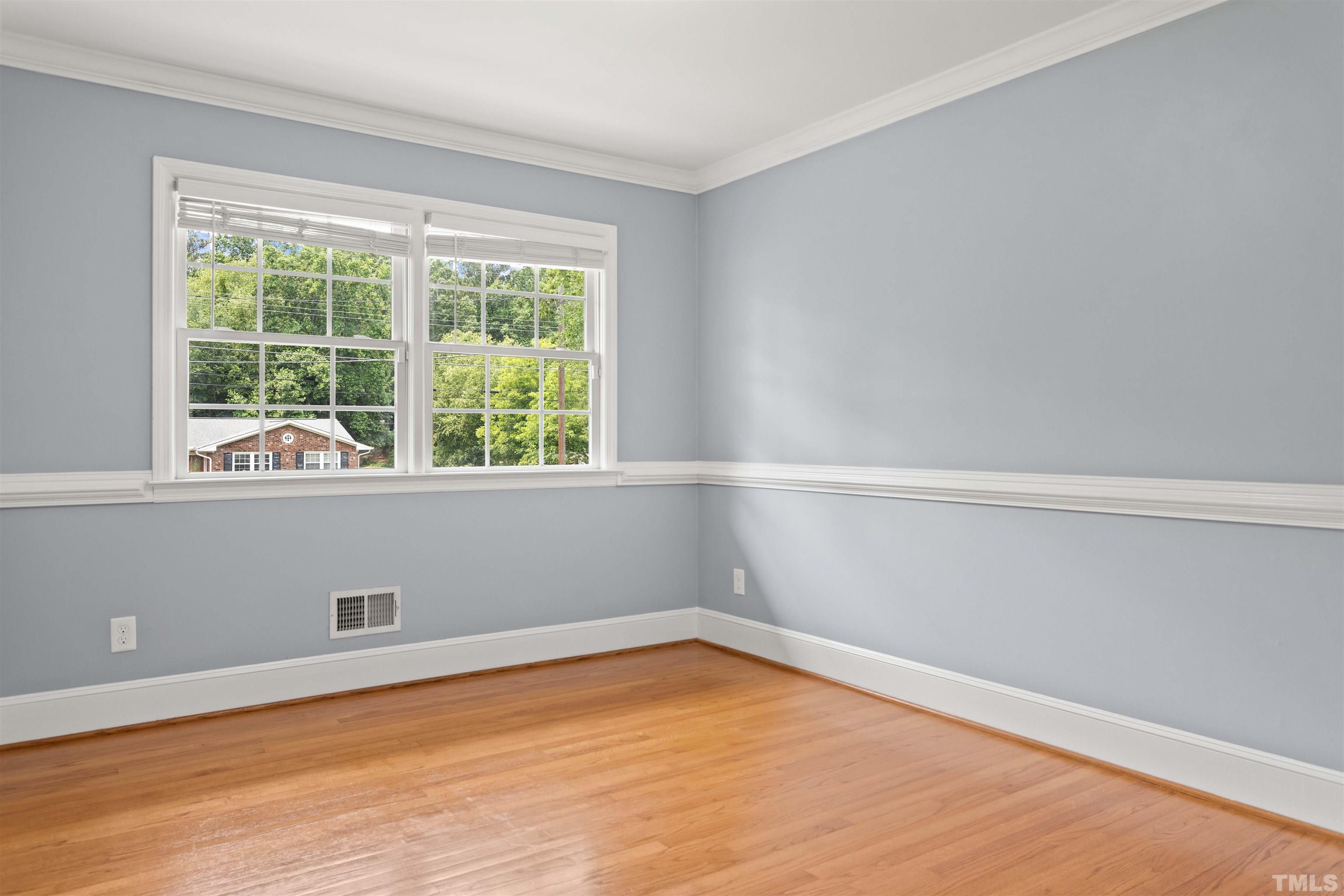 4811 Greenbrier Road Raleigh, NC 27603 - Photo 35 of 41 a view of empty room with wooden floor and fan