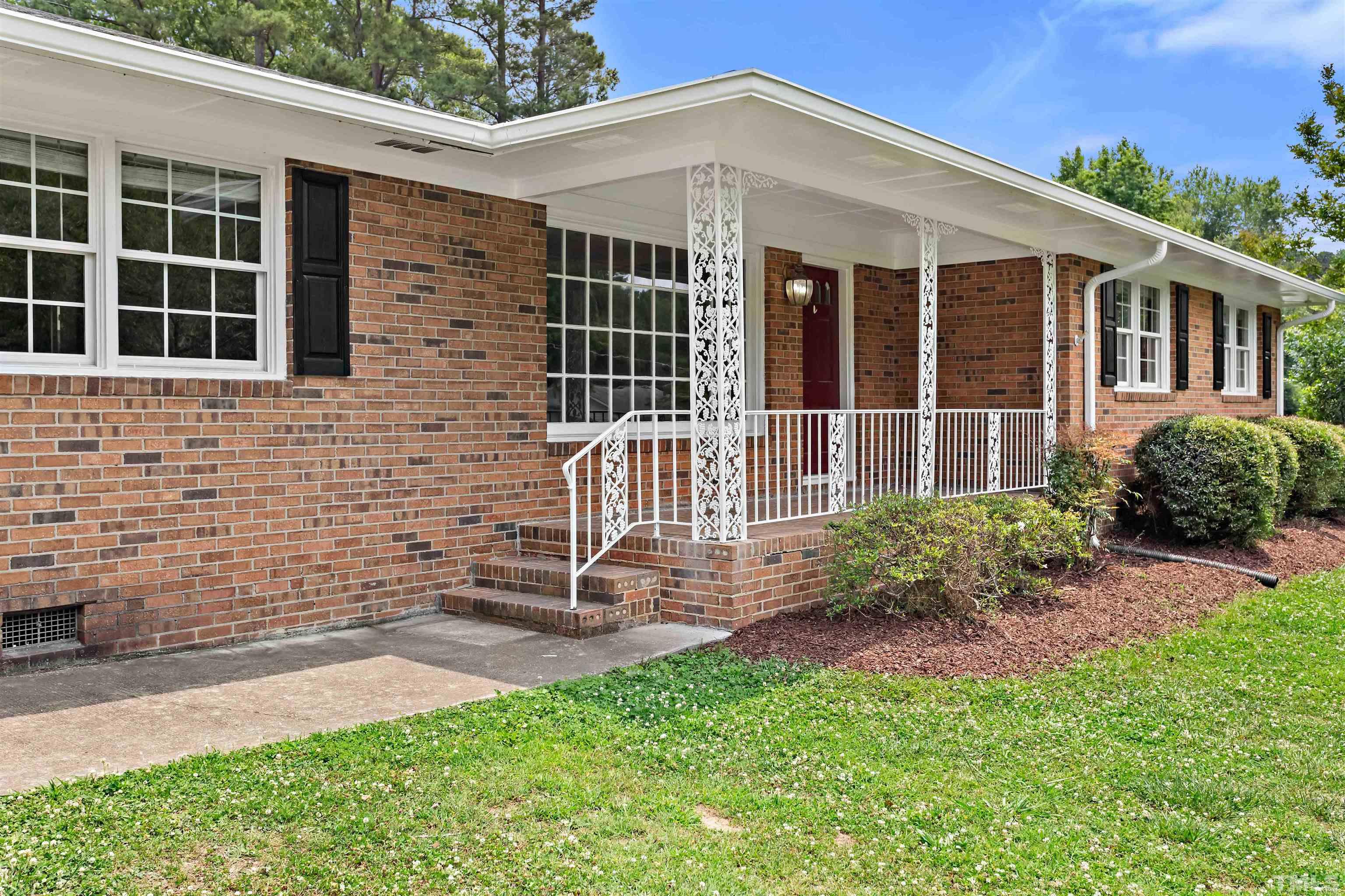 4811 Greenbrier Road Raleigh, NC 27603 - Photo 41 of 41 a front view of a house with garden