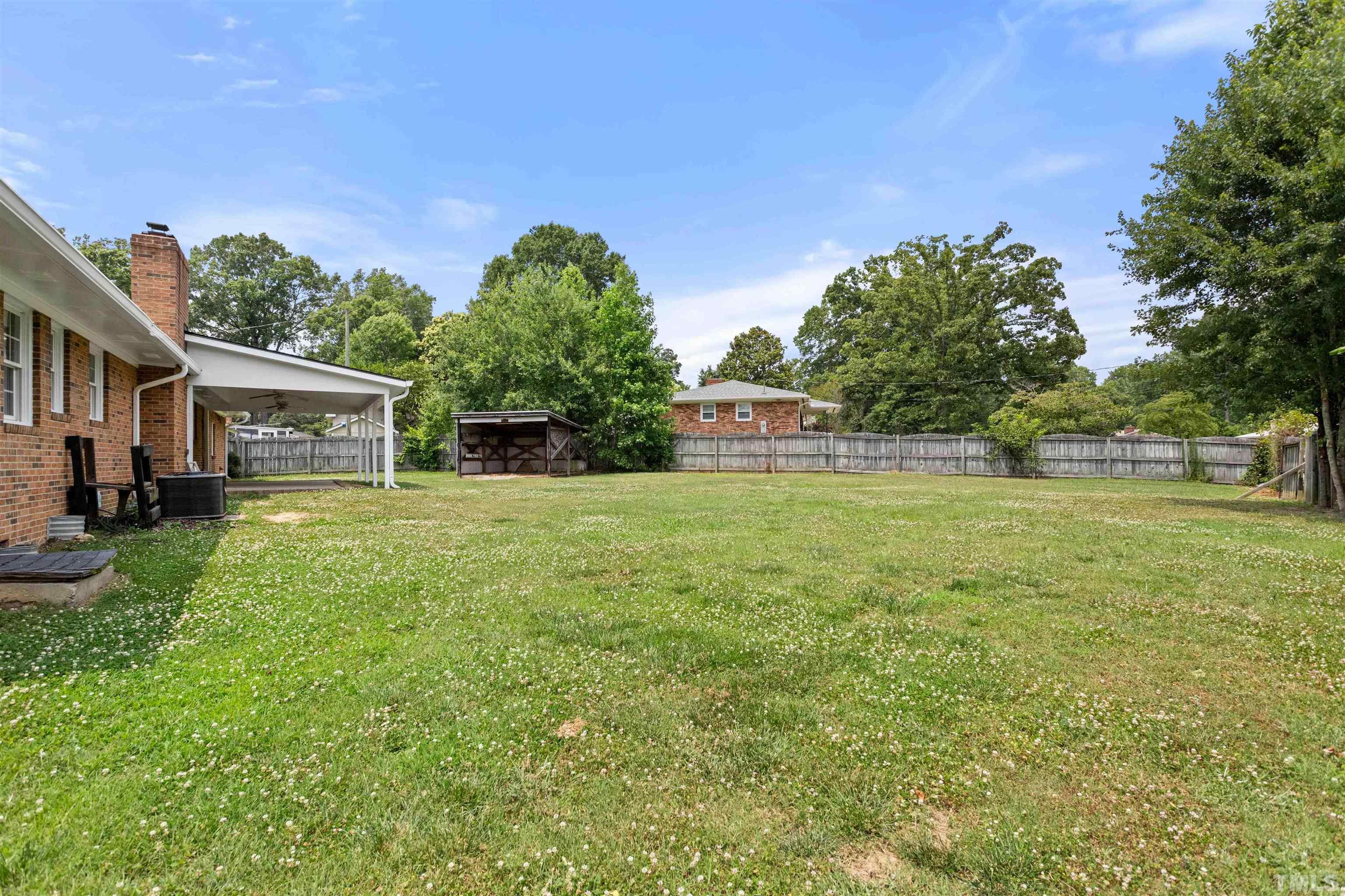4811 Greenbrier Road Raleigh, NC 27603 - Photo 5 of 41 a house view with a garden space